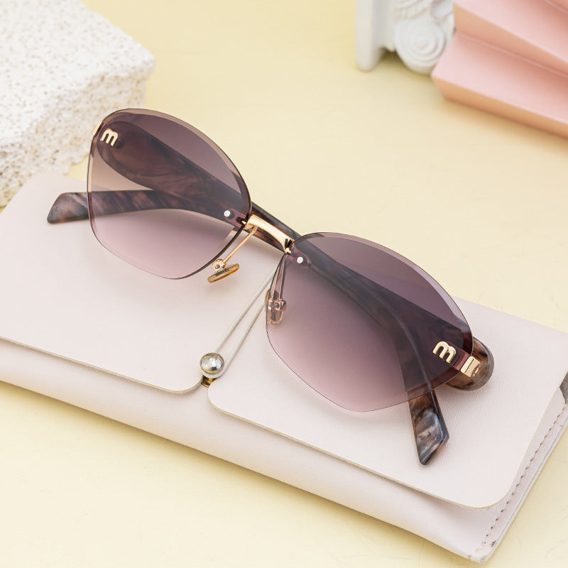 Luxury Cat-Eye Frameless Sunglasses for Women – Diamond Cut Edge & UV Protection